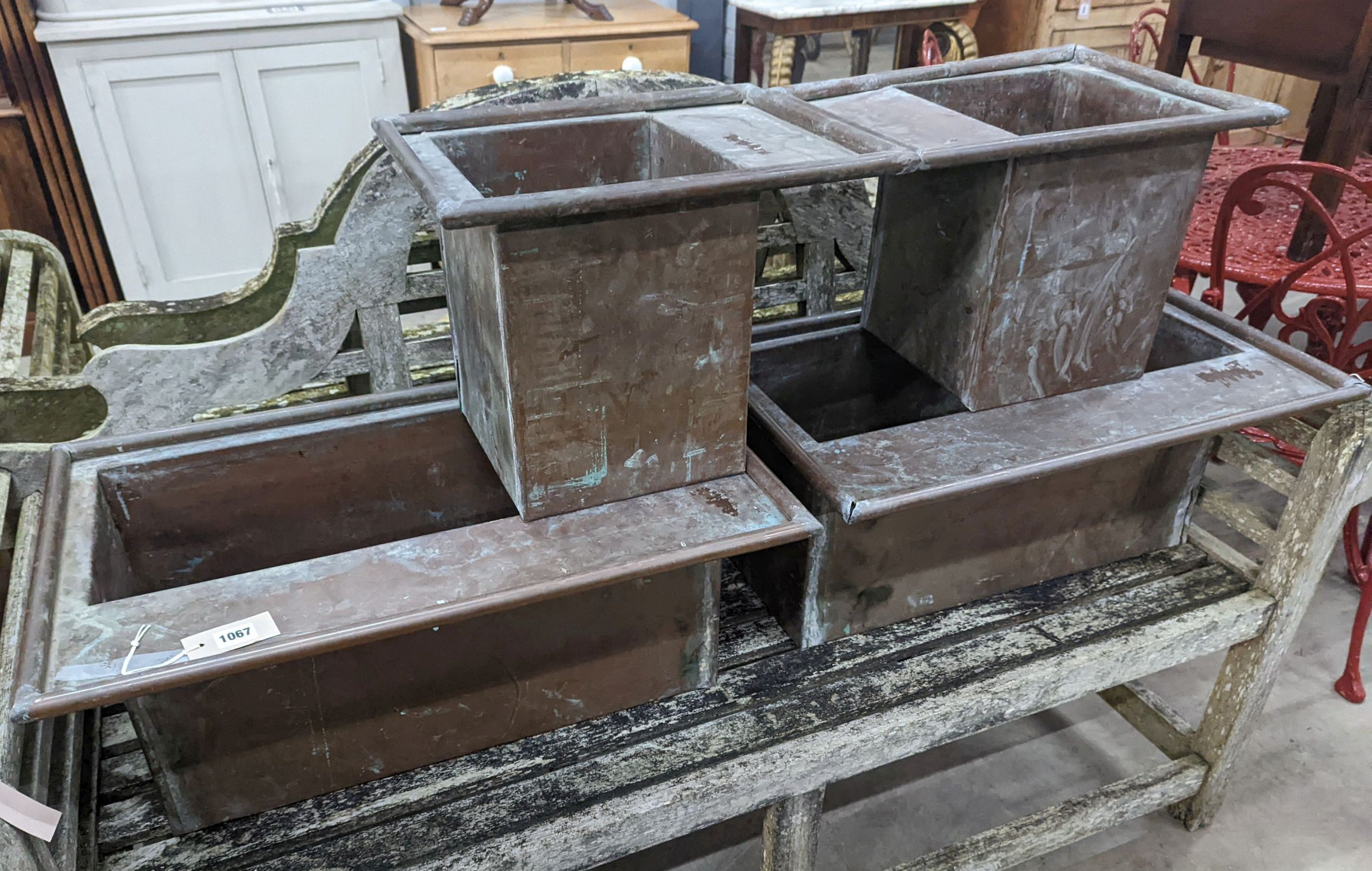 Four rectangular copper planters, larger width 62cm, height 42cm